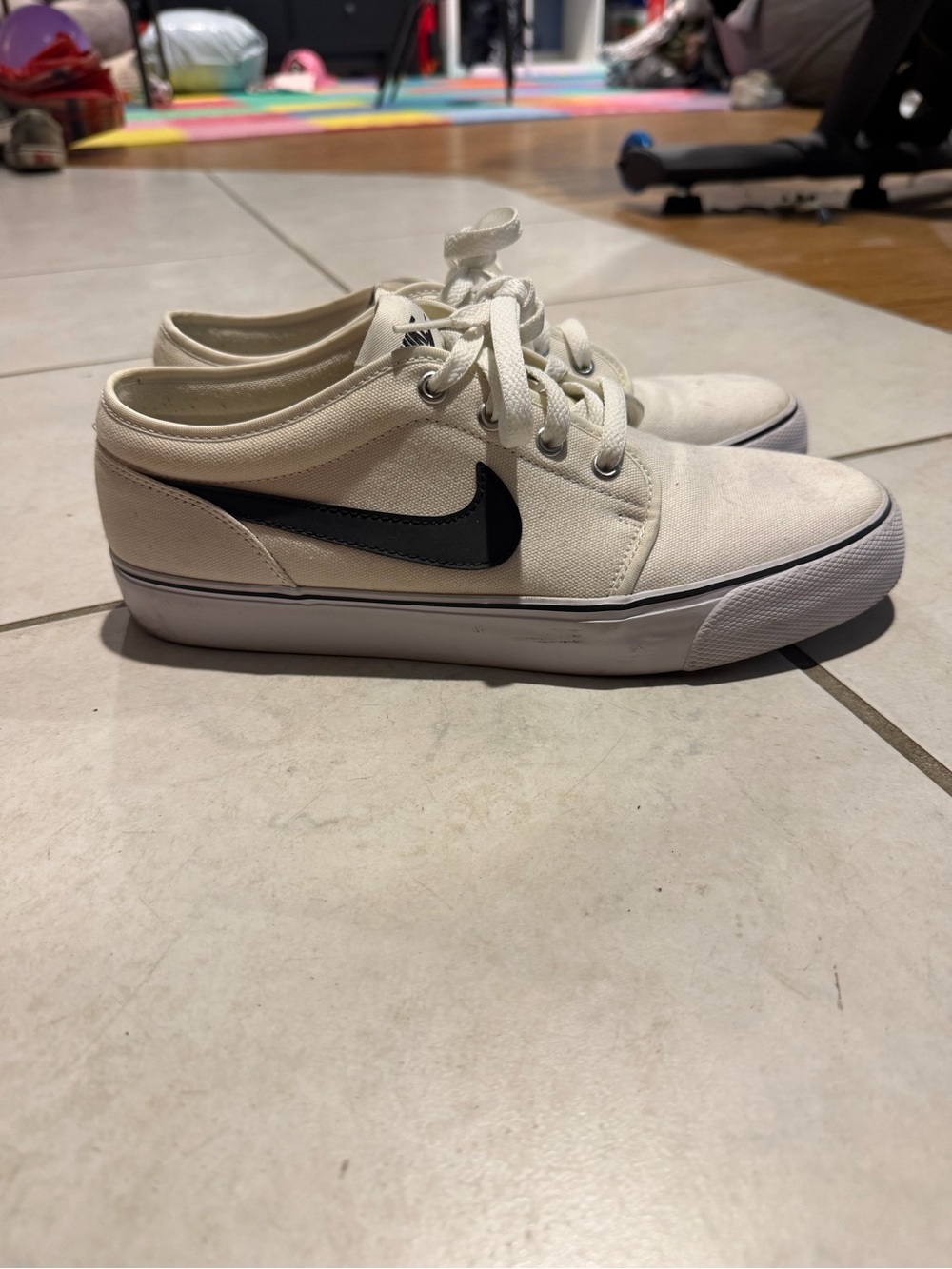 Nike White Canvas Low-Top Sneakers with Black Swoosh